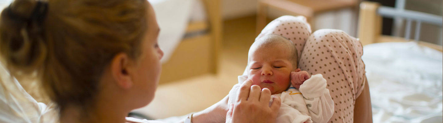 Mother holding newborn