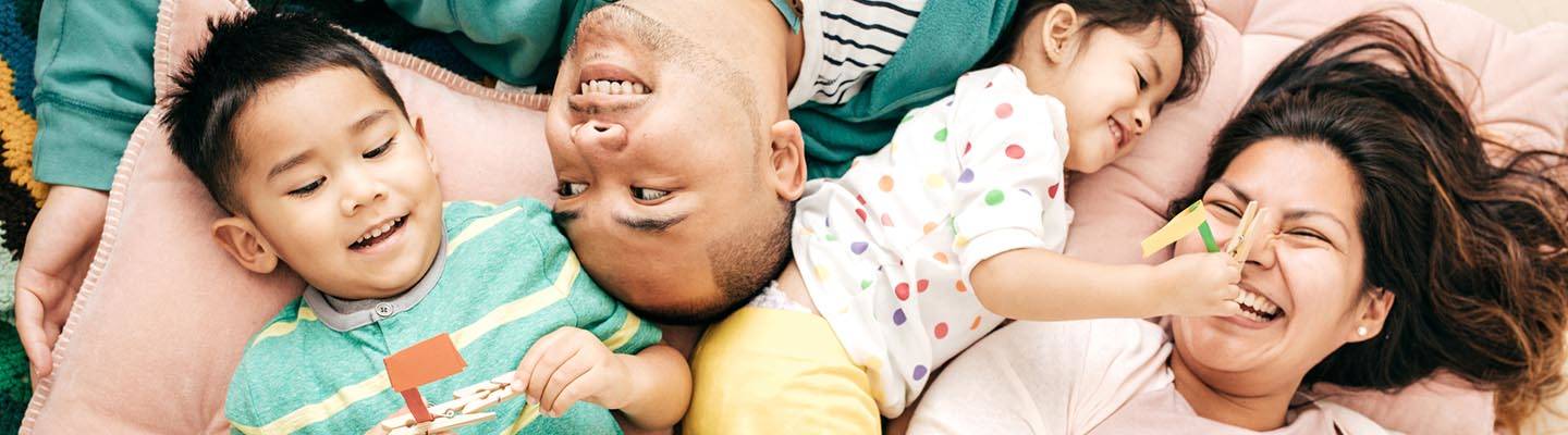 parents with small children laughing