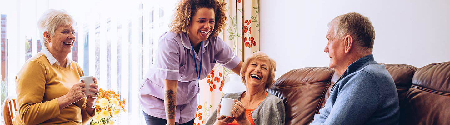 seniors laughing in retirement home