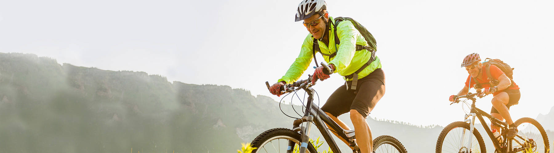 two-men-riding-bikes-outdoors